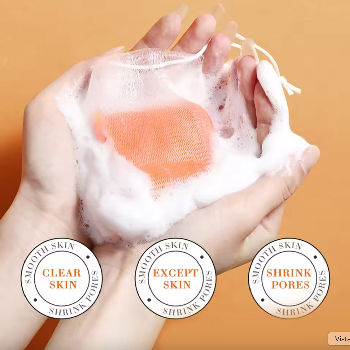 Hand holding a bar of soap with lather, against a beige background